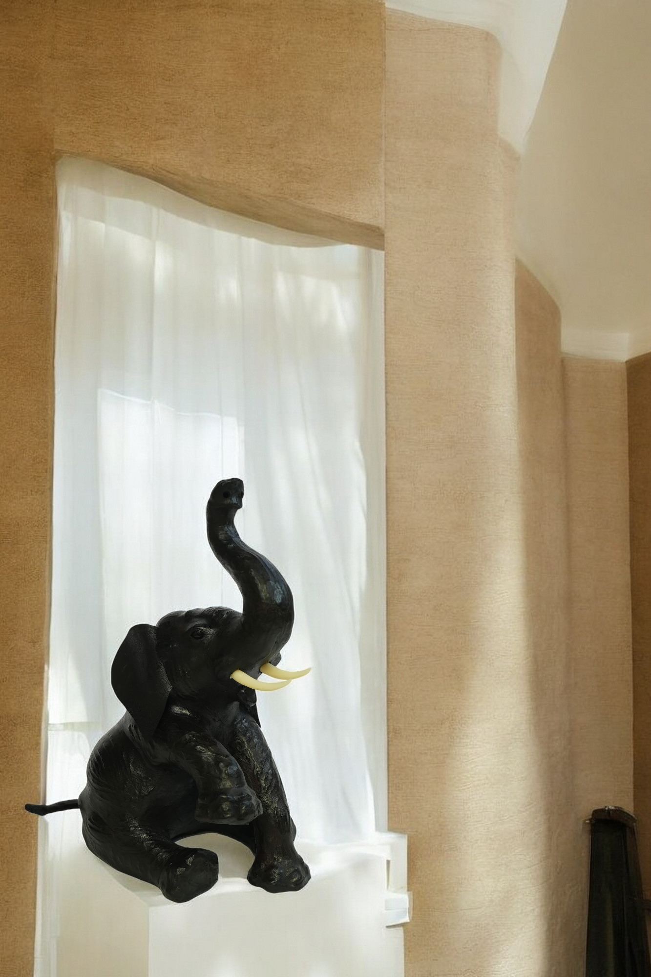 Handmade eco-friendly leather elephant statue with raised trunk and rustic finish