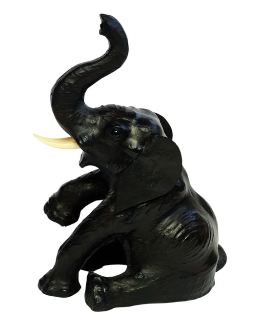 Handmade eco-friendly leather elephant statue with raised trunk and rustic finish
